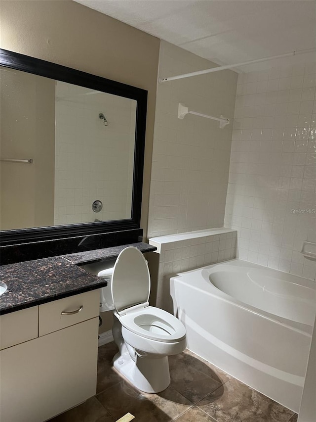 full bathroom featuring vanity, tiled shower / bath, tile patterned floors, and toilet