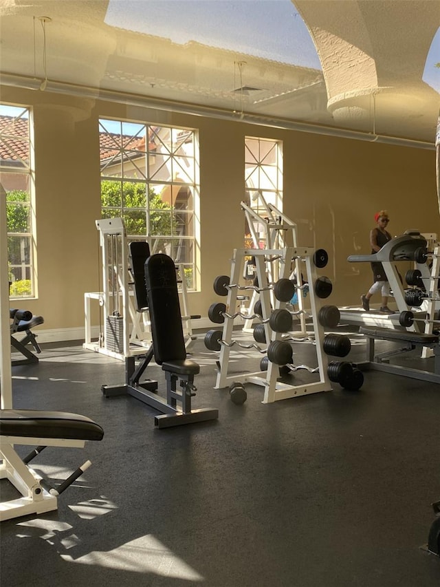 exercise room featuring crown molding and a textured ceiling