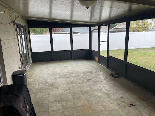 unfurnished sunroom with a wealth of natural light