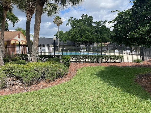 view of yard featuring a community pool