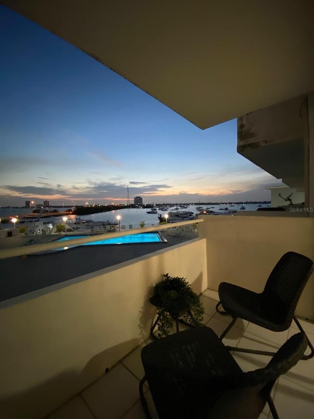 view of balcony at dusk