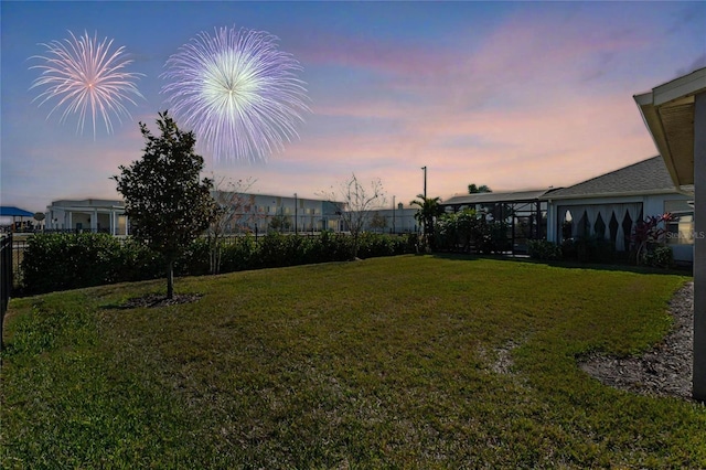 view of yard at dusk