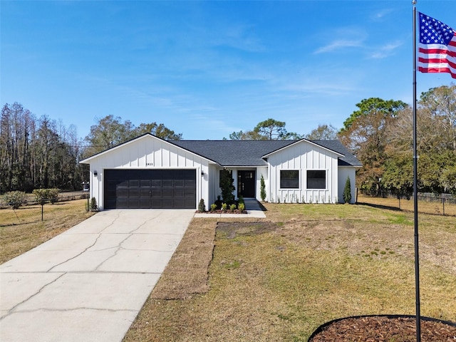 modern farmhouse style home with a garage and a front yard