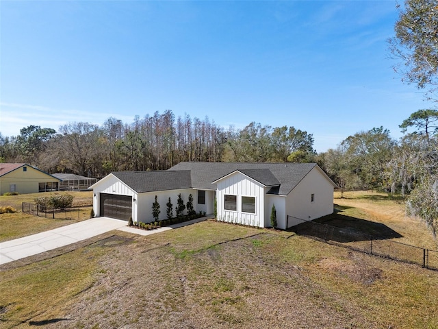 view of front facade featuring a garage and a front lawn