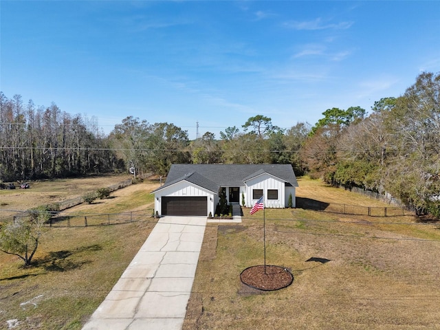 view of front of property with a garage and a front yard