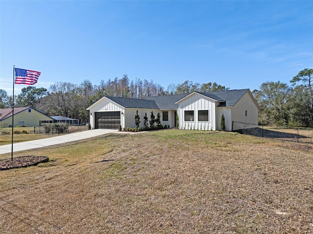 view of front facade with a garage and a front yard