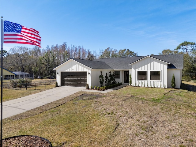 modern farmhouse style home with a garage and a front yard