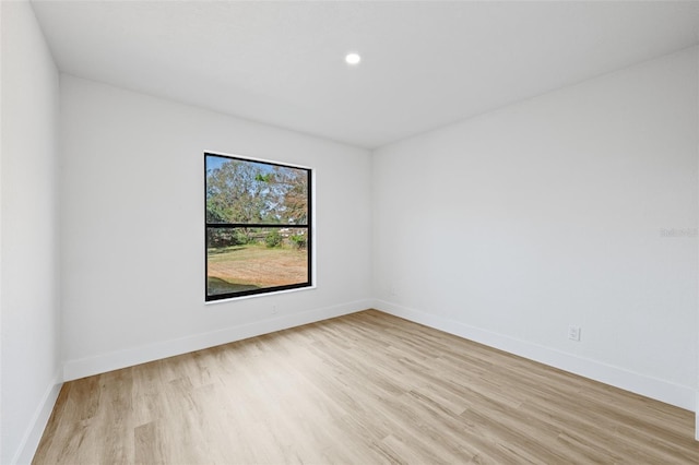 empty room with light hardwood / wood-style floors