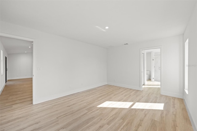 spare room featuring light wood-type flooring