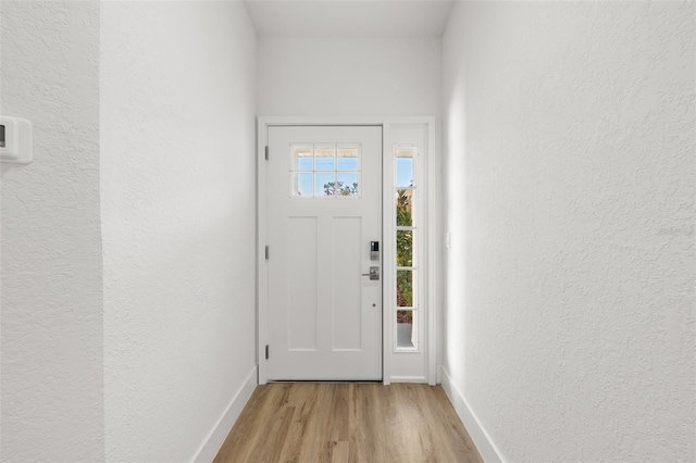 doorway to outside featuring light hardwood / wood-style floors