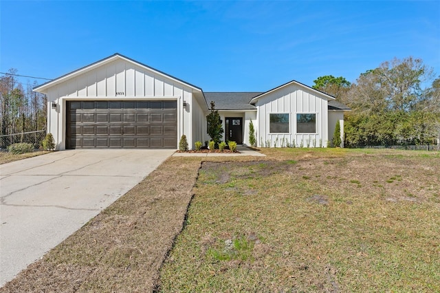 modern farmhouse style home with a garage and a front yard