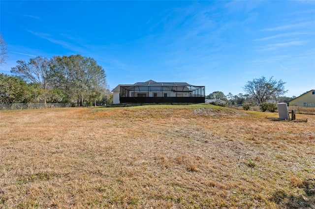 view of yard featuring a lanai