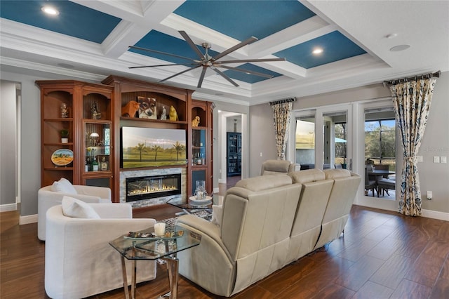 living room featuring coffered ceiling, ceiling fan, ornamental molding, and dark hardwood / wood-style floors