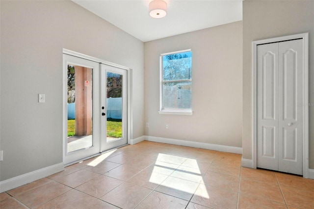 interior space featuring french doors and light tile patterned flooring