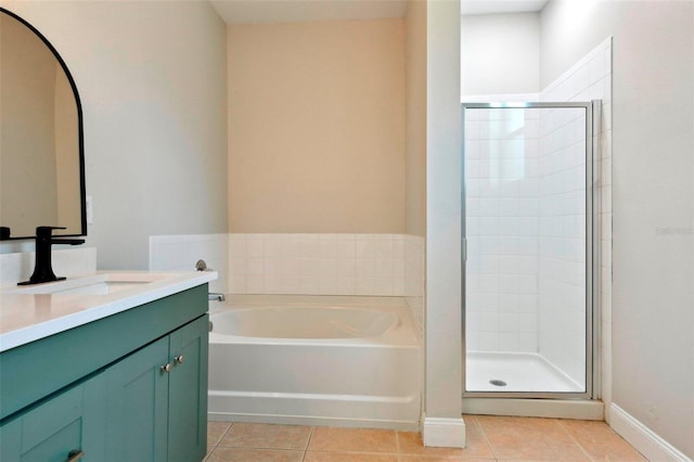 bathroom featuring vanity, tile patterned floors, and shower with separate bathtub