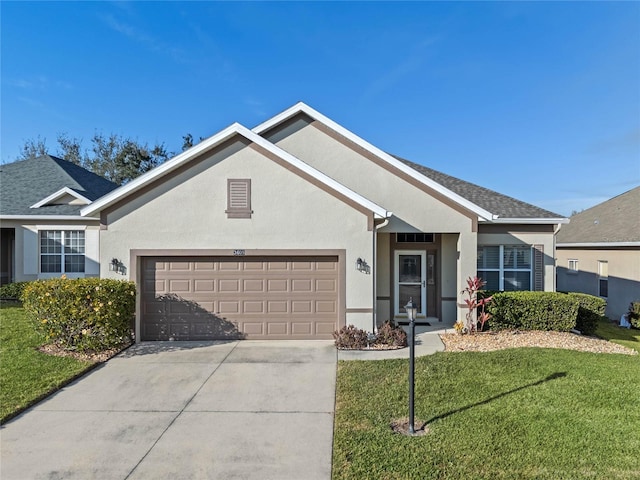 single story home featuring a garage and a front yard