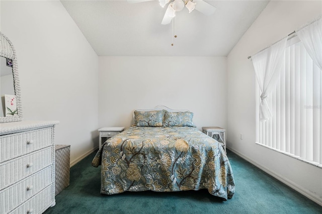 carpeted bedroom featuring multiple windows, vaulted ceiling, and ceiling fan