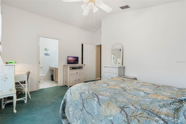 carpeted bedroom with ceiling fan, ensuite bathroom, and high vaulted ceiling