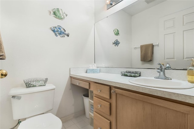 bathroom with vanity, tile patterned floors, and toilet