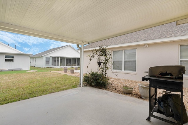 view of patio / terrace featuring a sunroom