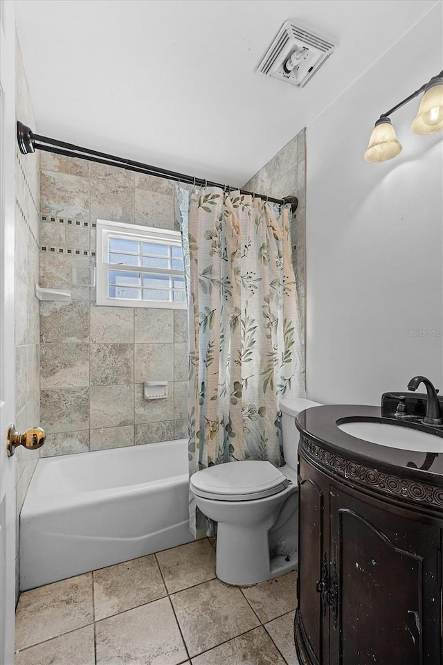 full bathroom with tile patterned flooring, vanity, shower / bathtub combination with curtain, and toilet