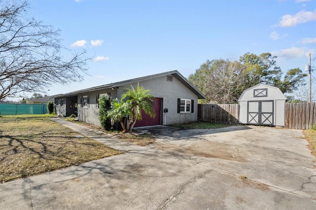 exterior space with a lawn and a shed