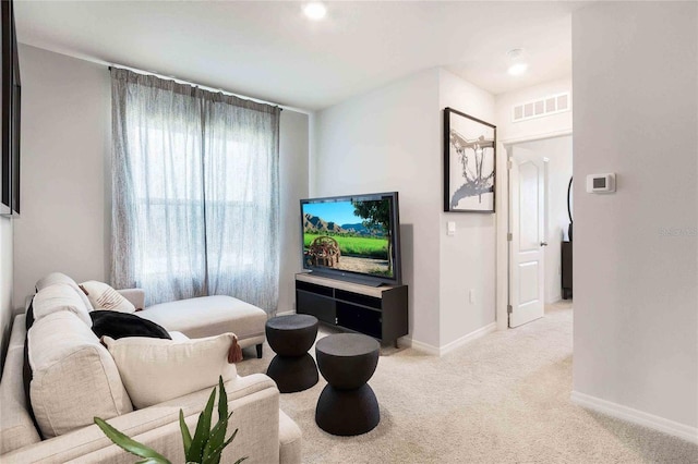 living room featuring light colored carpet