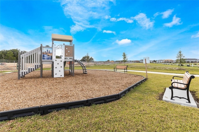 view of jungle gym featuring a yard