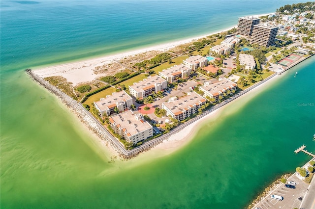 birds eye view of property featuring a view of the beach and a water view