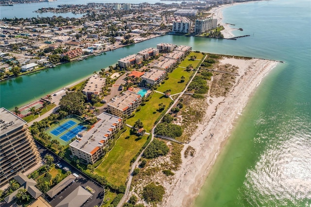 drone / aerial view featuring a beach view and a water view