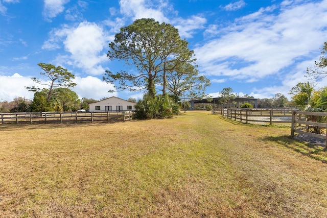 view of yard with a rural view