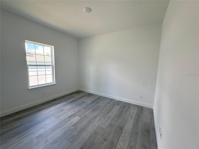 empty room with hardwood / wood-style floors