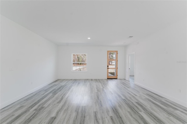 unfurnished room featuring light hardwood / wood-style flooring