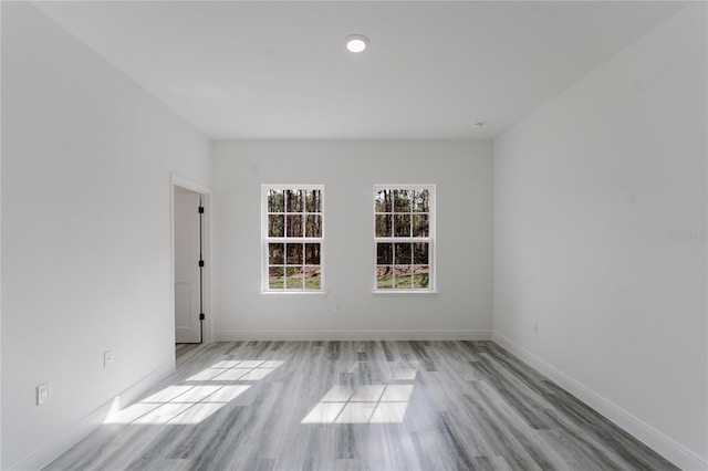 spare room featuring light hardwood / wood-style floors