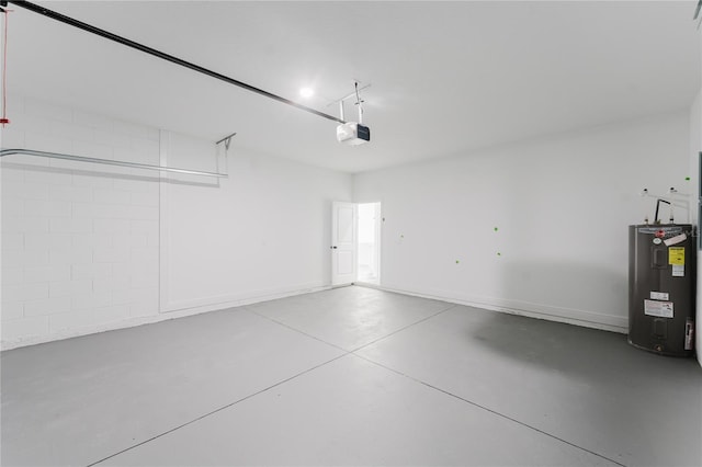 garage featuring a garage door opener and electric water heater