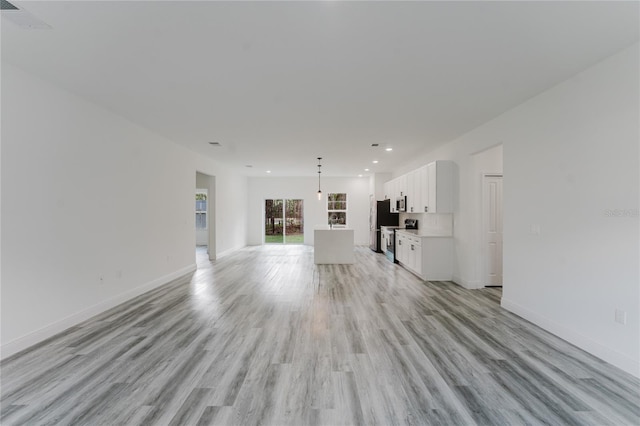 unfurnished living room with light hardwood / wood-style flooring