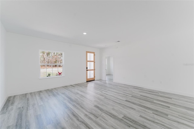 unfurnished room featuring light hardwood / wood-style floors