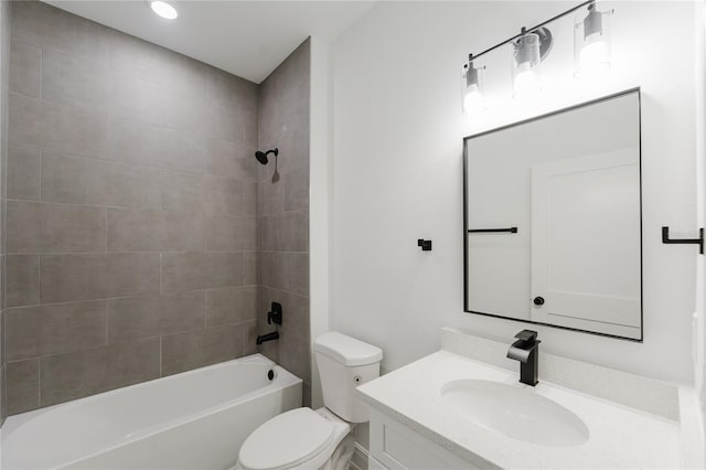 full bathroom featuring vanity, tiled shower / bath combo, and toilet