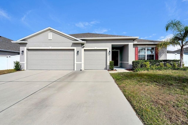 single story home featuring a garage and a front lawn