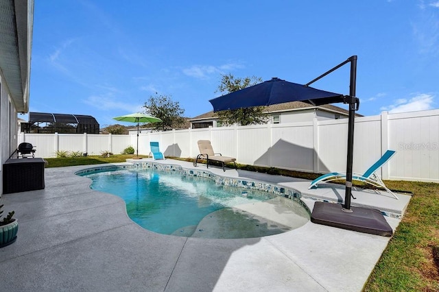 view of swimming pool featuring a patio area