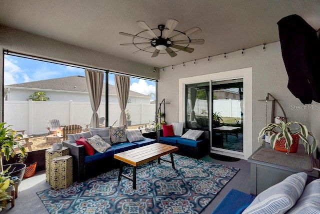 carpeted living room featuring ceiling fan