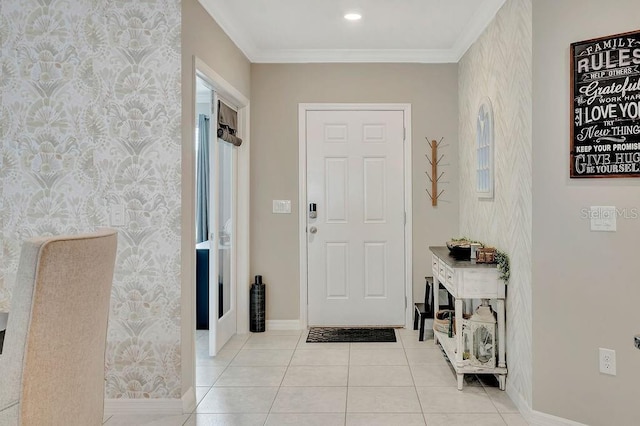 foyer featuring ornamental molding and light tile patterned flooring