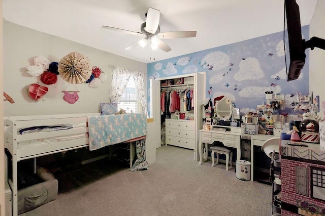 bedroom featuring light carpet, a closet, and ceiling fan