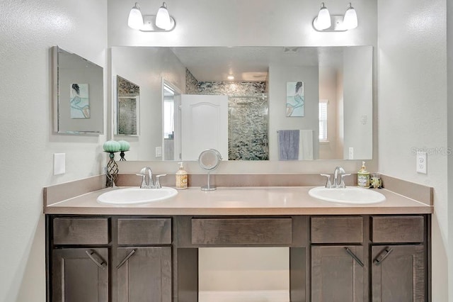 bathroom with vanity and a shower with shower door