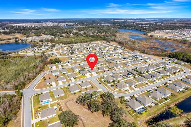 birds eye view of property featuring a water view