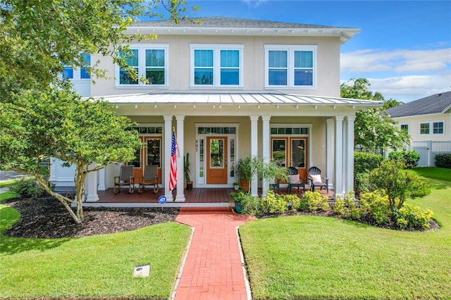 view of front facade featuring a porch and a front lawn