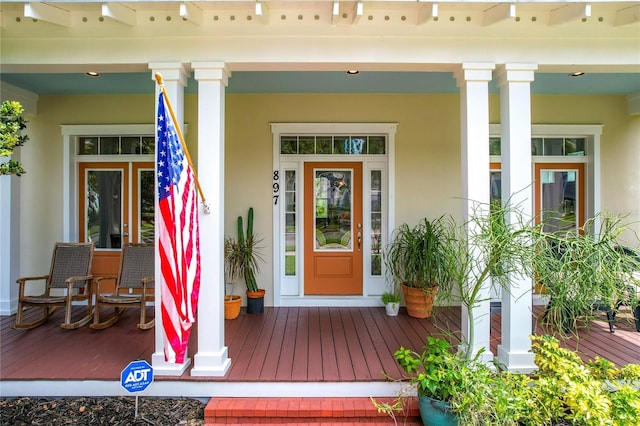 doorway to property featuring covered porch