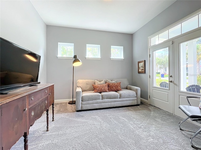 carpeted living room featuring french doors