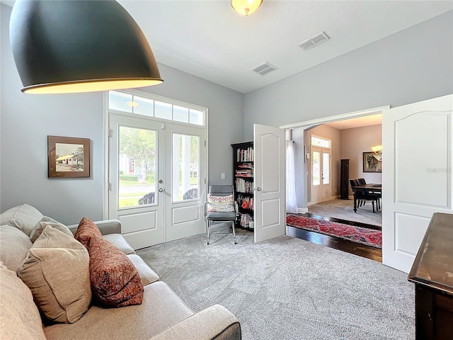 interior space with french doors and carpet flooring