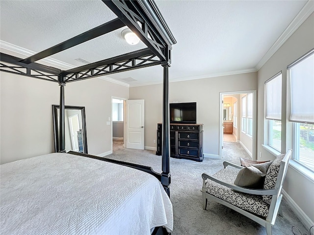 bedroom with crown molding, light carpet, and a textured ceiling